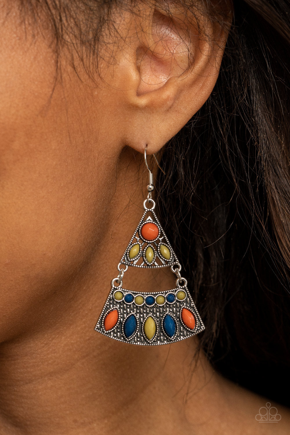 Desert Fiesta - Multi Studded Earrings Mismatched blue, green, and Rust colored beads adorn the fronts of studded triangular and rectangular silver frames that link into a tribal inspired lure. Earring attaches to a standard fishhook fitting.  Sold as one pair of earrings.