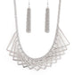 Metro Mirage - Silver Collar Necklaces a shiny collection of silver V-shape frames delicately overlap below the collar, creating an edgy optical illusion. Features an adjustable clasp closure.  Sold as one individual necklace. Includes one pair of matching earrings.  Paparazzi Jewelry is lead and nickel free so it's perfect for sensitive skin too!