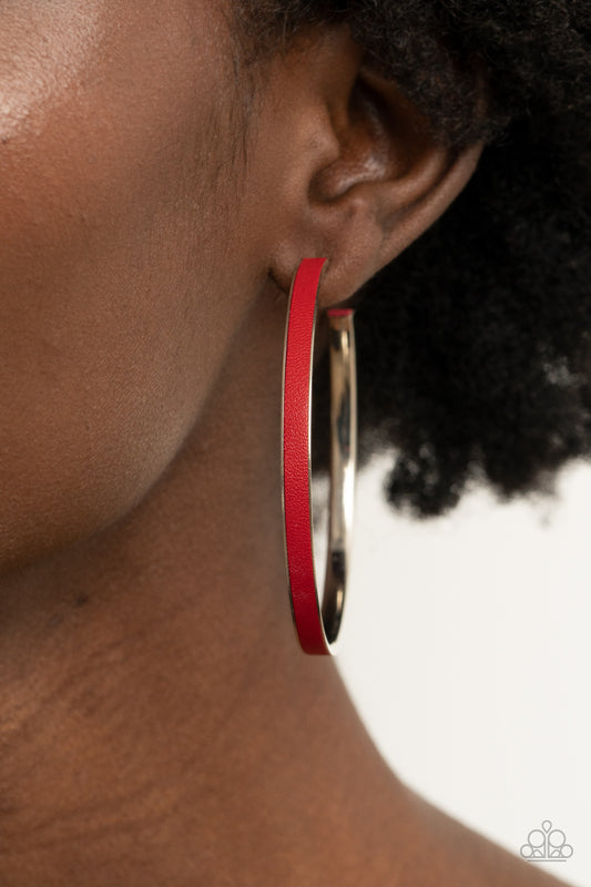 Fearless Flavor - Red Leather Hoop Earrings red leather lace is pressed along the indented spine of a silver hoop, creating a bold pop of color. Earring attaches to a standard post fitting. Hoop measures approximately 2 1/4" in diameter.  Sold as one pair of hoop earrings.  Paparazzi Jewelry is lead and nickel free so it's perfect for sensitive skin too!