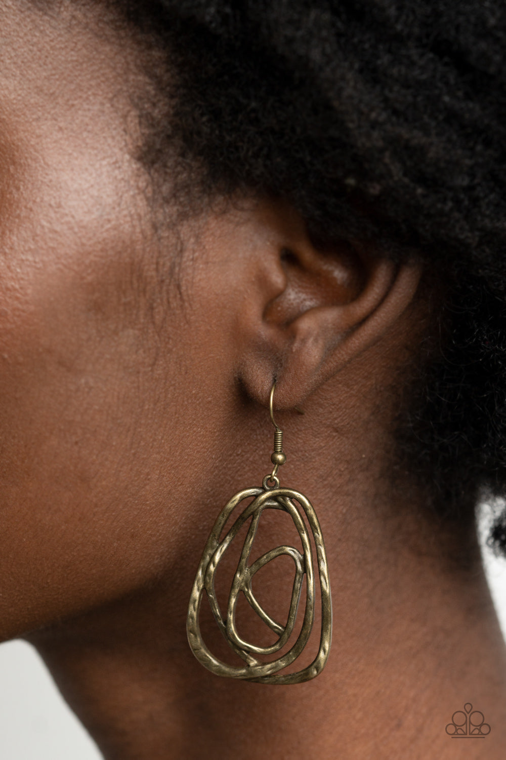 Paparazzi Accessories Artisan Relic - Brass Earrings featuring a hammered finish, a rustic brass wire delicately wraps into an asymmetrical frame for a dizzying artisan inspired look. Earring attaches to a standard fishhook fitting.  Sold as one pair of earrings.