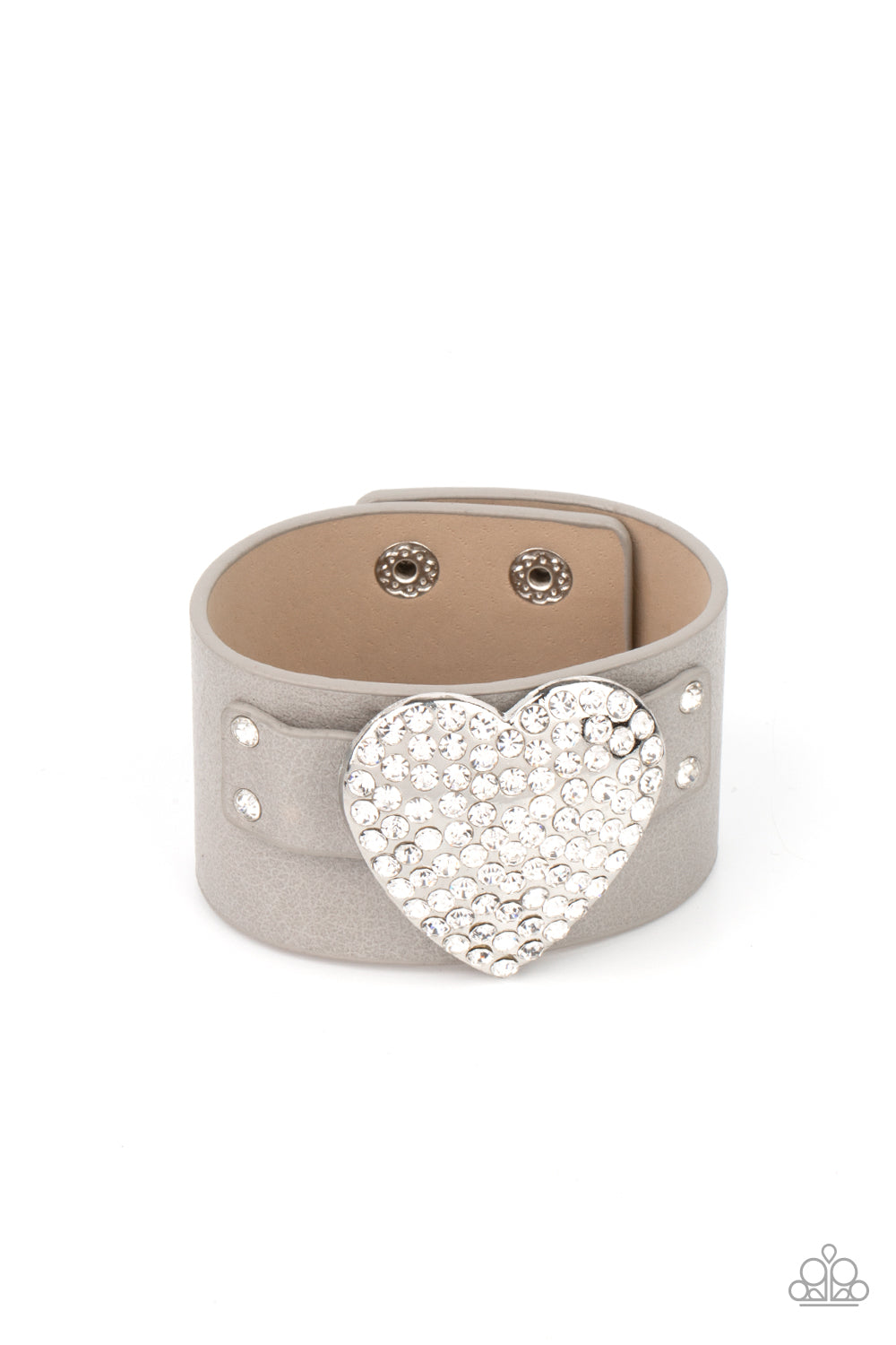 Flauntable Flirt - Silver Bracelets encrusted in blinding white rhinestones, an oversized silver heart frame is studded in place across the front of a gray leather band, creating a flirtatious centerpiece around the wrist. Features an adjustable snap closure. Sold as one individual bracelet. Paparazzi Jewelry is lead and nickel free so it's perfect for sensitive skin too!