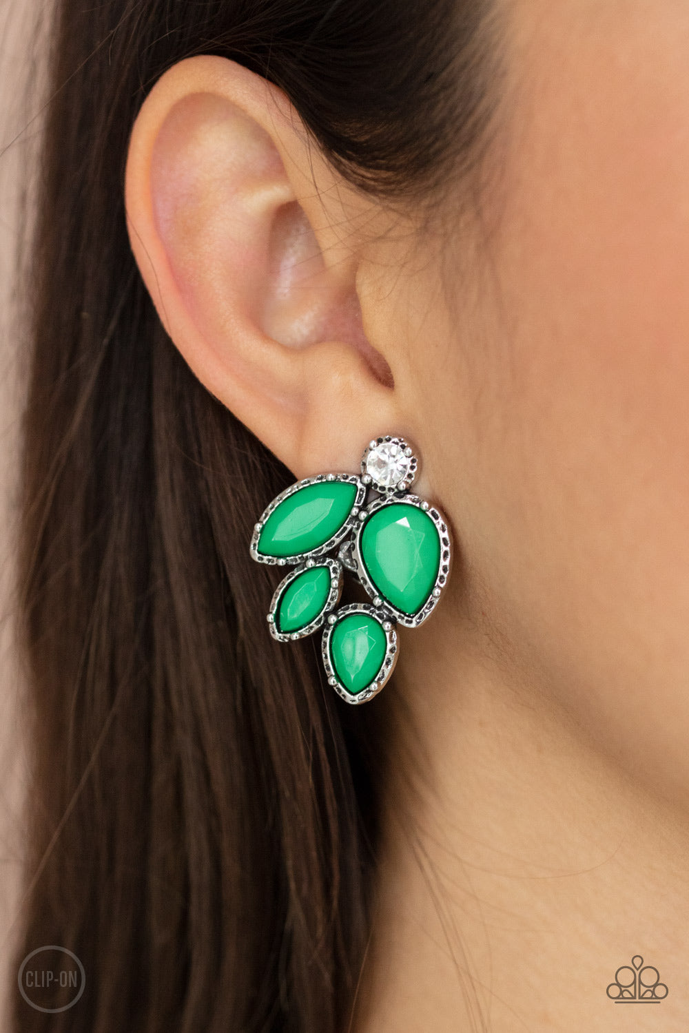 Fancy Foliage - Green Clip-On Earrings featuring a dainty white rhinestone, faceted Mint teardrop and marquise beads are pressed into hammered silver fittings that coalesce into a leafy frame. Earring attaches to a standard clip-on fitting. Sold as one pair of clip-on earrings. Paparazzi Jewelry is lead and nickel free so it's perfect for sensitive skin too!