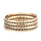 Paparazzi Accessories Back-To-Back Stacks - Multi Bracelets embossed in slanted ribbons of textured and studded hammered patterns, trios of mismatched brass and gold bangles stack across the wrist for an intense industrial vibe.  Sold as one set of six bracelets.