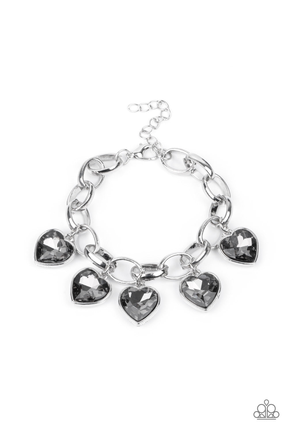Candy Heart Charmer - Silver Bracelets a smoky heart-shaped gems are encased in sleek silver frames that swing from an oversized silver chain, creating a sparkly fringe around the wrist. Features an adjustable clasp closure. Sold as one individual bracelet. Paparazzi Jewelry is lead and nickel free so it's perfect for sensitive skin too!