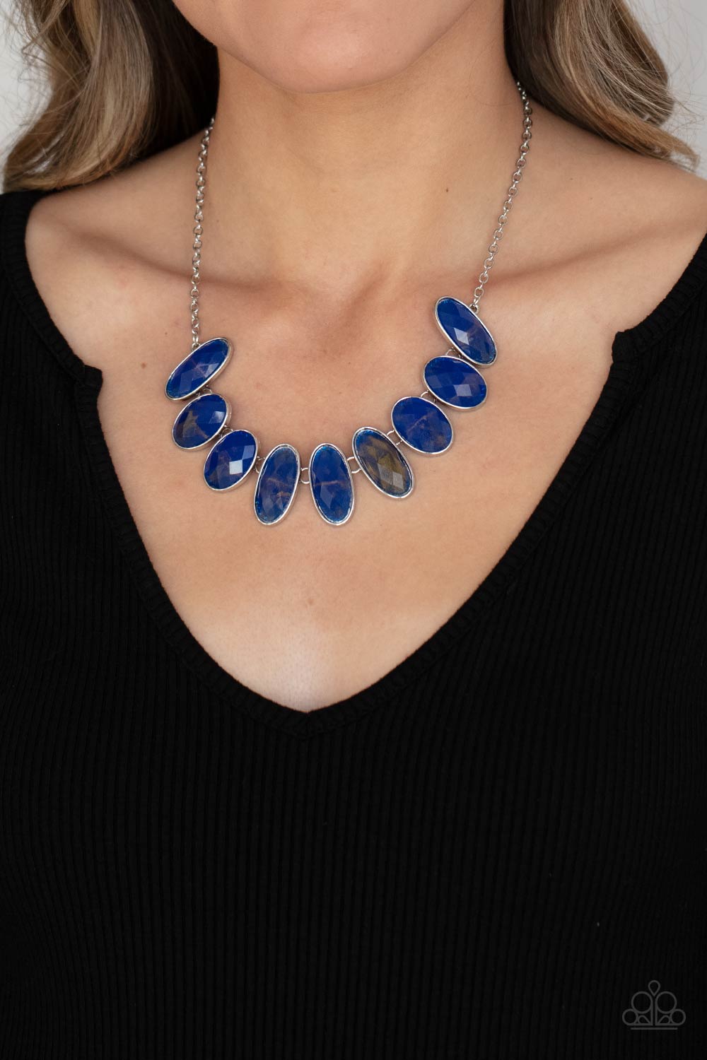 Elliptical Episode - Blue Glassy Necklaces generous bright blue glassy gems, dusted in shimmery gold, lay in silver oval frames and link across the collar creating a glimmering statement. Features an adjustable clasp closure. Sold as one individual necklace. Includes one pair of matching earrings. Paparazzi Jewelry is lead and nickel free so it's perfect for sensitive skin too!