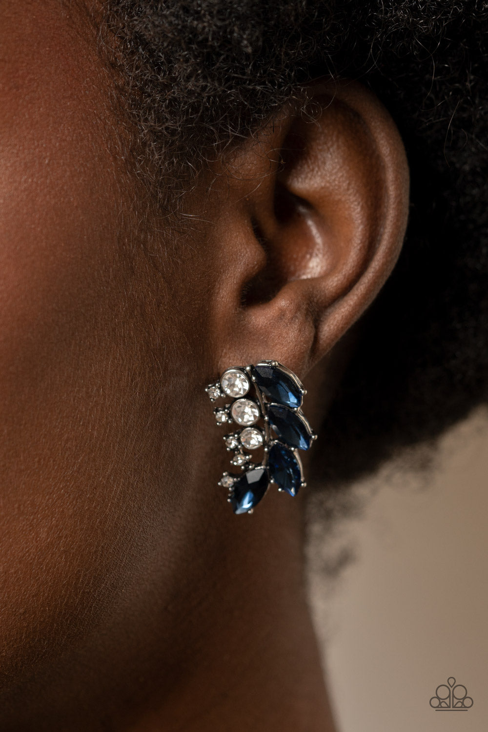 Flawless Fronds - Blue Rhinestone Post Earrings - Paparazzi Accessories a frond of dazzling blue marquise and round white rhinestones delicately curves below the ear for a flawless finish. Earring attaches to a standard post fitting. Sold as one pair of post earrings.