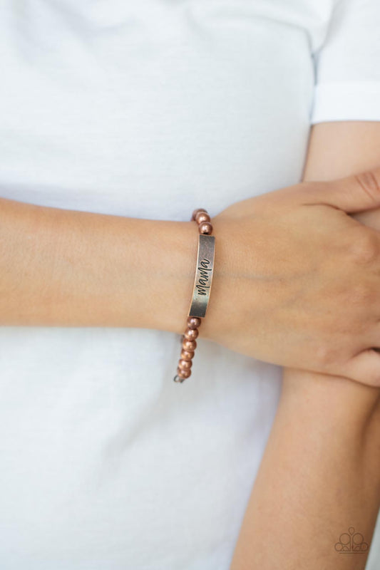 Mom Squad - Copper Bead Bracelets stamped in the word, "Mama," a curved copper plate attaches to strands of copper beads threaded along invisible wire around the wrist, creating a sentimental centerpiece. Features an adjustable clasp closure.  Sold as one individual bracelet.