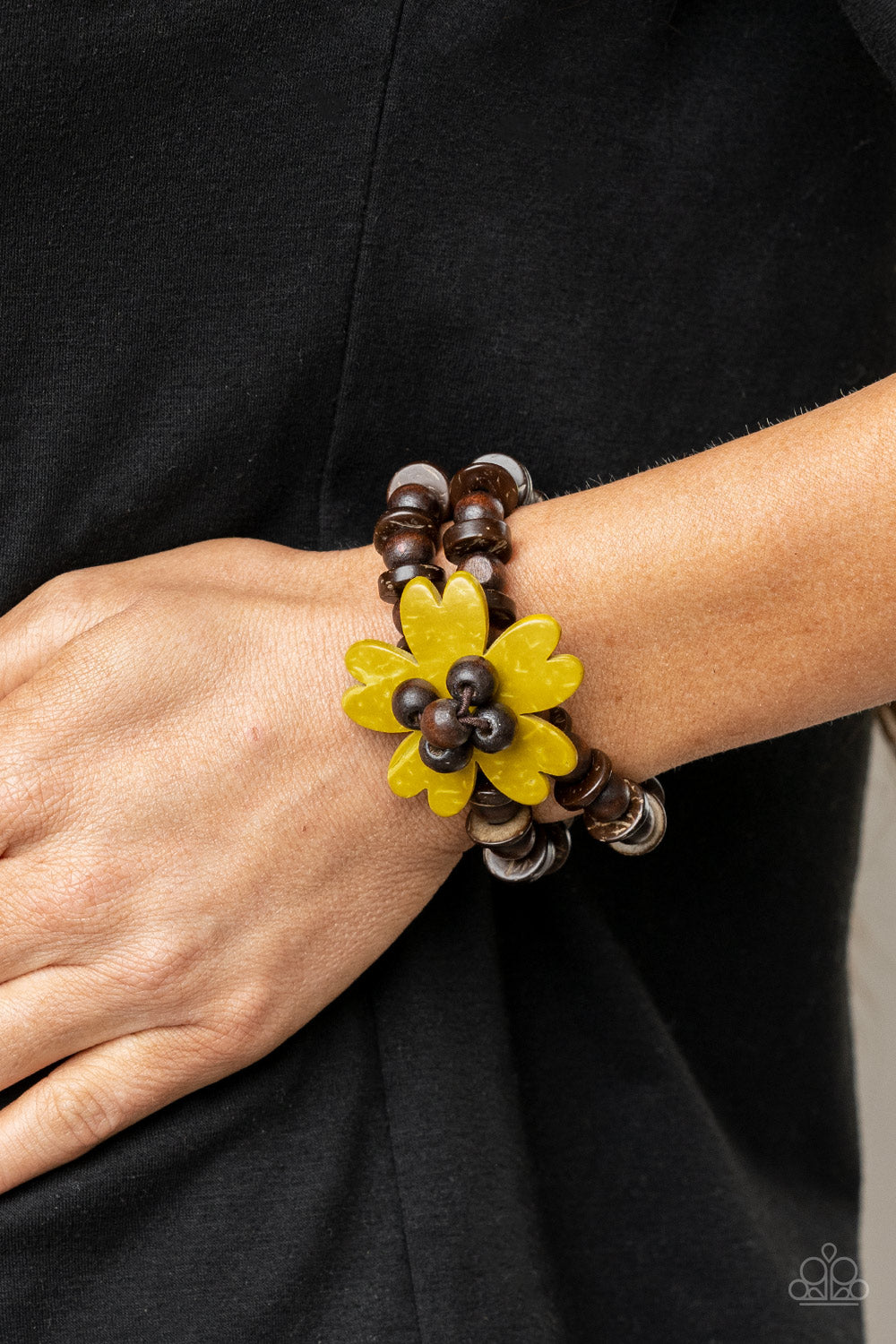 Paparazzi Tropical Flavor - Yellow Wood Bracelets featuring heart-shaped petals, a sunny yellow wooden flower sits atop double strands of wooden beads threaded along stretchy bands for a tropical flair atop the wrist. Sold as one individual bracelet.