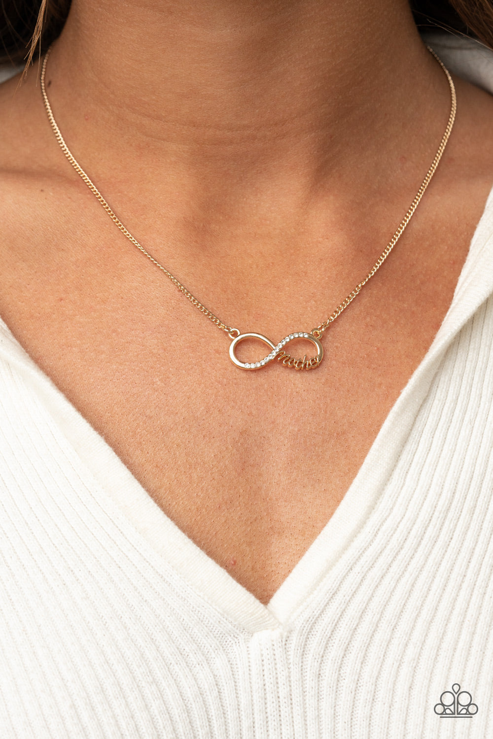 Forever Your Mom - Gold Infinity Necklaces a bright gold infinity symbol features the word "Mother" in filigree script across the bottom. A row of sparkly dainty rhinestones travels across the curve creating a lovingly charming sentiment as it connects to a dainty gold chain below the collar. Features an adjustable clasp closure. Sold as one individual necklace. Includes one pair of matching earrings.
