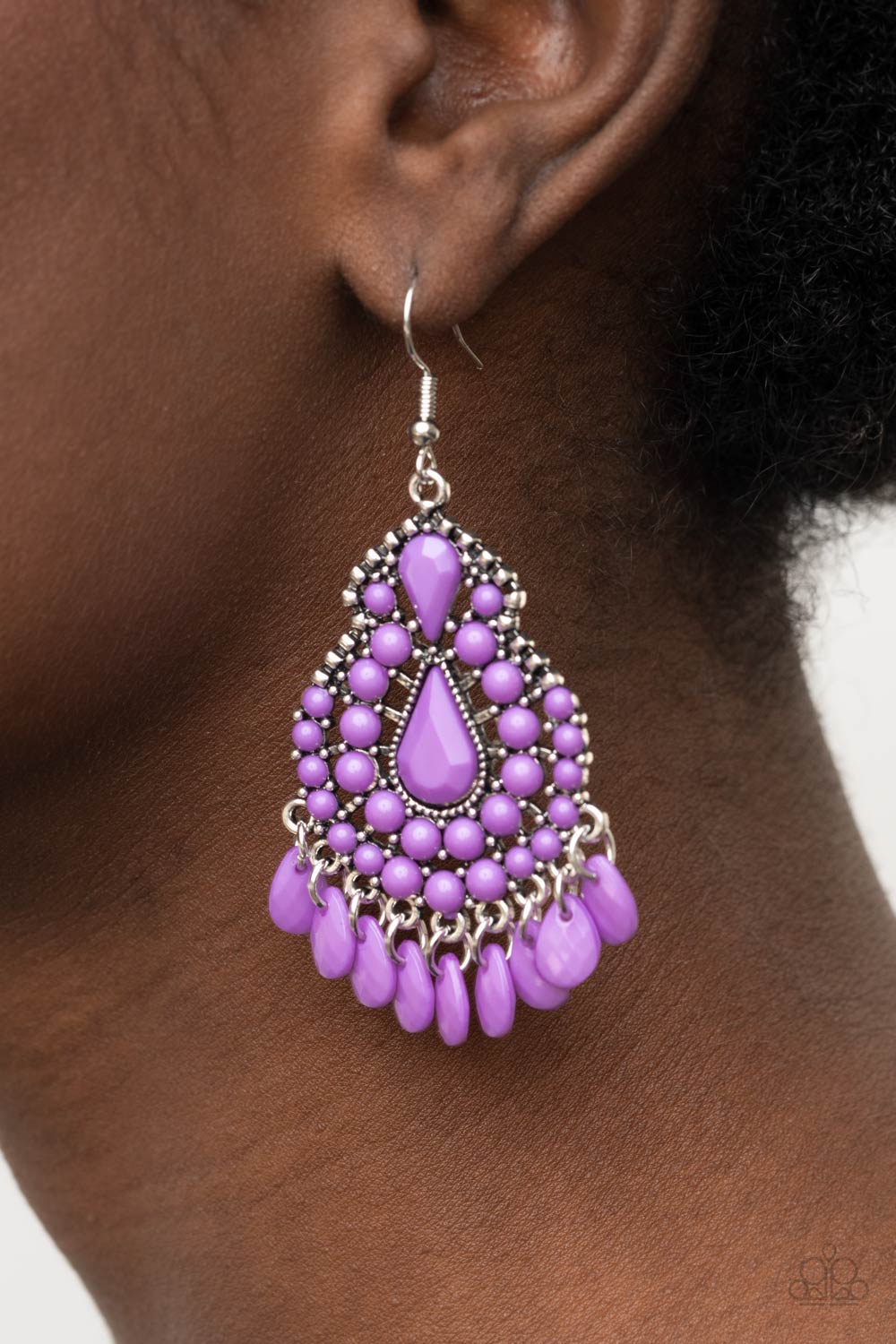 Paparazzi Accessories Persian Posh - Purple Fishhook Earrings amethyst Orchid beads dress up an irregular-shaped antiqued silver teardrop frame. A row of faceted teardrop beads create a flirty fringe along the bottom of the frame for a posh finish. Earring attaches to a standard fishhook fitting.