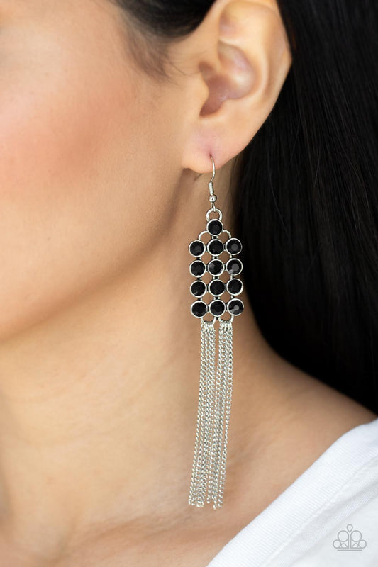 Tasteful Tassel - Black Rhinestone Earrings - Paparazzi Accessories encased in sleek silver fittings, rows of glittery black rhinestones stack into a sparkly frame. Dainty silver chains stream from the bottom of the dazzling frame, adding flirtatious movement to the timelessly tasseled display. Earring attaches to a standard fishhook fitting.