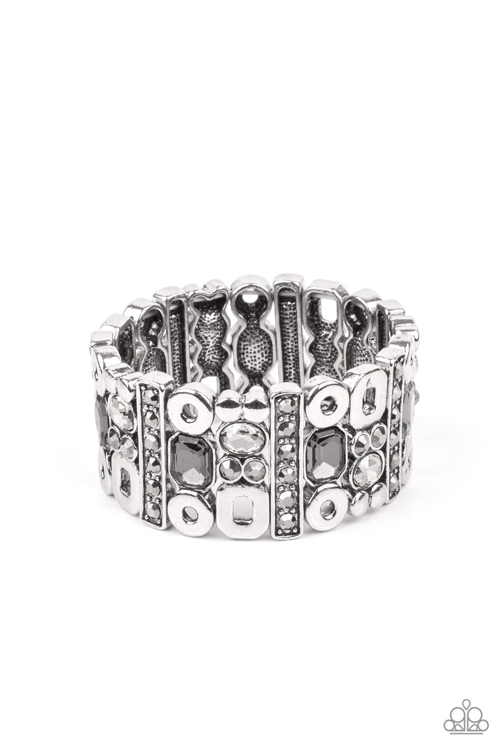 Paparazzi Accessories Dynamcally Diverse - Silver Stretch Bracelets infused with flat silver studs and geometric silver accents, a mismatched assortment of oval, round, and emerald style hematite and smoky rhinestones coalesce into edgy frames along a stretchy band for an intense sparkle around the wrist.