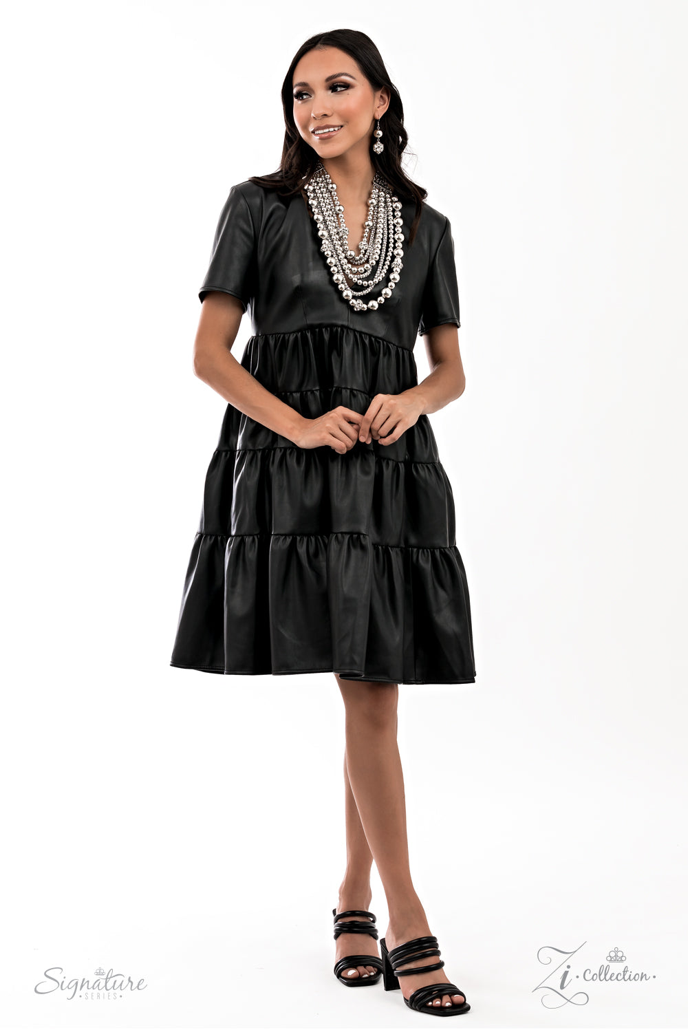 The Liberty - 2021 Zi Collection Necklace held together by rectangular silver frames, a couture-clutching collection of oversized silver beads interspersed with white rhinestone encrusted ornaments alternates with interlocking rows of white rhinestone encrusted chains across the chest. Edgily enhanced with linked rows of silver chain fittings, the emboldened silver layers demand to be seen with their unapologetic attitude. Features an adjustable clasp closure.