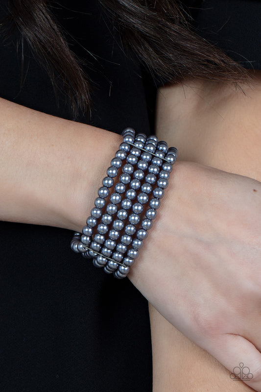 A Pearly Affair - Silver Grey Pearl Stretch Bracelets stacked layers of luminous grey pearl-like beads are threaded along stretchy bands creating a subtly indulgent allure around the wrist.  Sold as one individual bracelet.  Paparazzi Jewelry is lead and nickel free so it's perfect for sensitive skin too!
