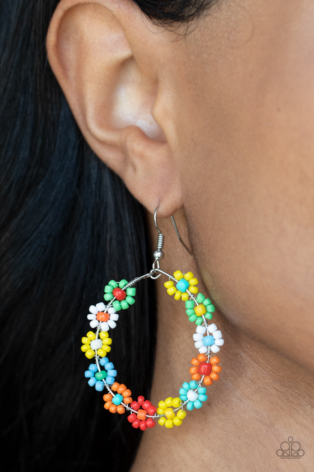 Festively Flower Child - Multi Hoop Earrings dotted with mismatched multicolored beaded centers, a dainty collection of multicolored seed beaded floral frames are threaded along a wire hoop for a fabulous floral fashion. Earring attaches to a standard fishhook fitting. Sold as one pair of earrings. Paparazzi Jewelry is lead and nickel free so it's perfect for sensitive skin too!