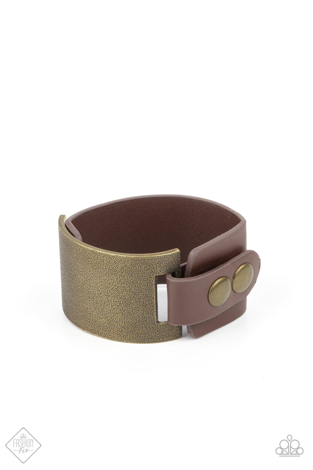 Studded Synchronism - Brass Wrap Bracelets curved brass panel, coated in antiqued texture, attaches to a wide brown leather band with brass snaps resulting in an edgy industrial element around the wrist. Features an adjustable snap closure.  Sold as one individual bracelet.  Paparazzi Jewelry is lead and nickel free so it's perfect for sensitive skin too!