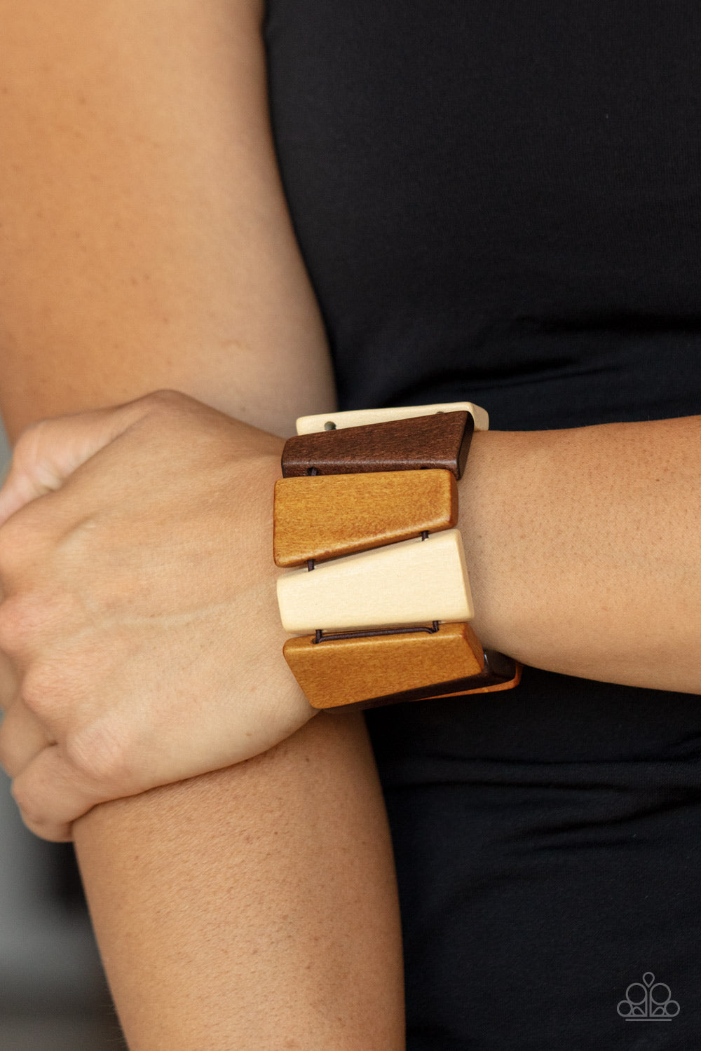 Barbados Backdrop - Multi Wood Frame - Paparazzi Accessories tinted in various shades of brown, chunky triangular wooden frames are threaded along stretchy bands around the wrist for an earthy look. Sold as one individual bracelet.