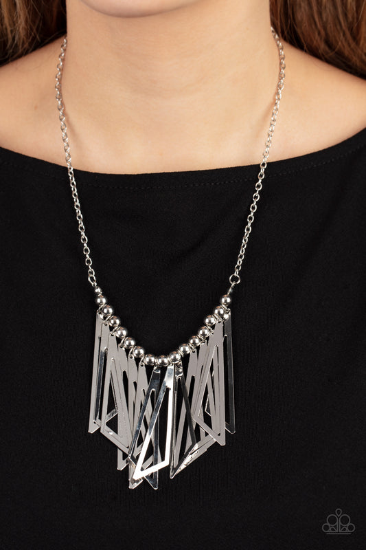 Industrial Jungle - Silver Triangular Frame Necklaces - Paparazzi Accessories flared silver triangular frames swing from a silver beaded chain below the collar, creating an intense industrial-inspired fringe at the bottom of a classic silver chain. Features an adjustable clasp closure.  Sold as one individual necklace. Includes one pair of matching earrings.