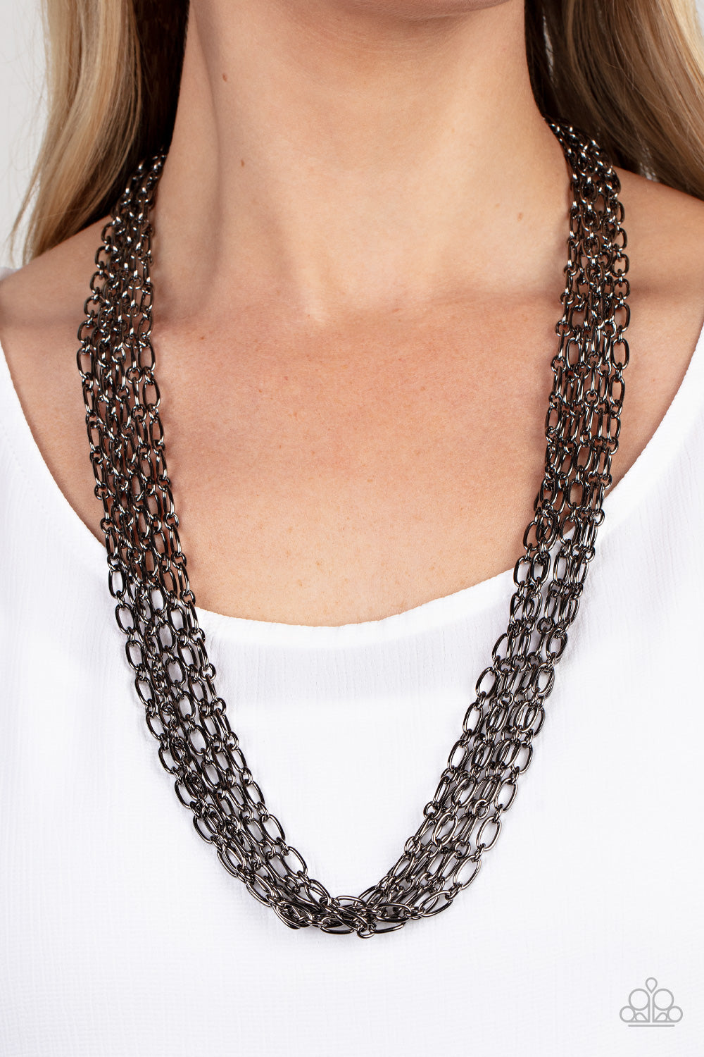 Paparazzi Accessories - Dynamite Dynamo - Black Chain Necklaces layer after layer of edgy gunmetal chains drape across the chest, creating an intense industrial display. Features an adjustable clasp closure.  Sold as one individual necklace. Includes one pair of matching earrings.