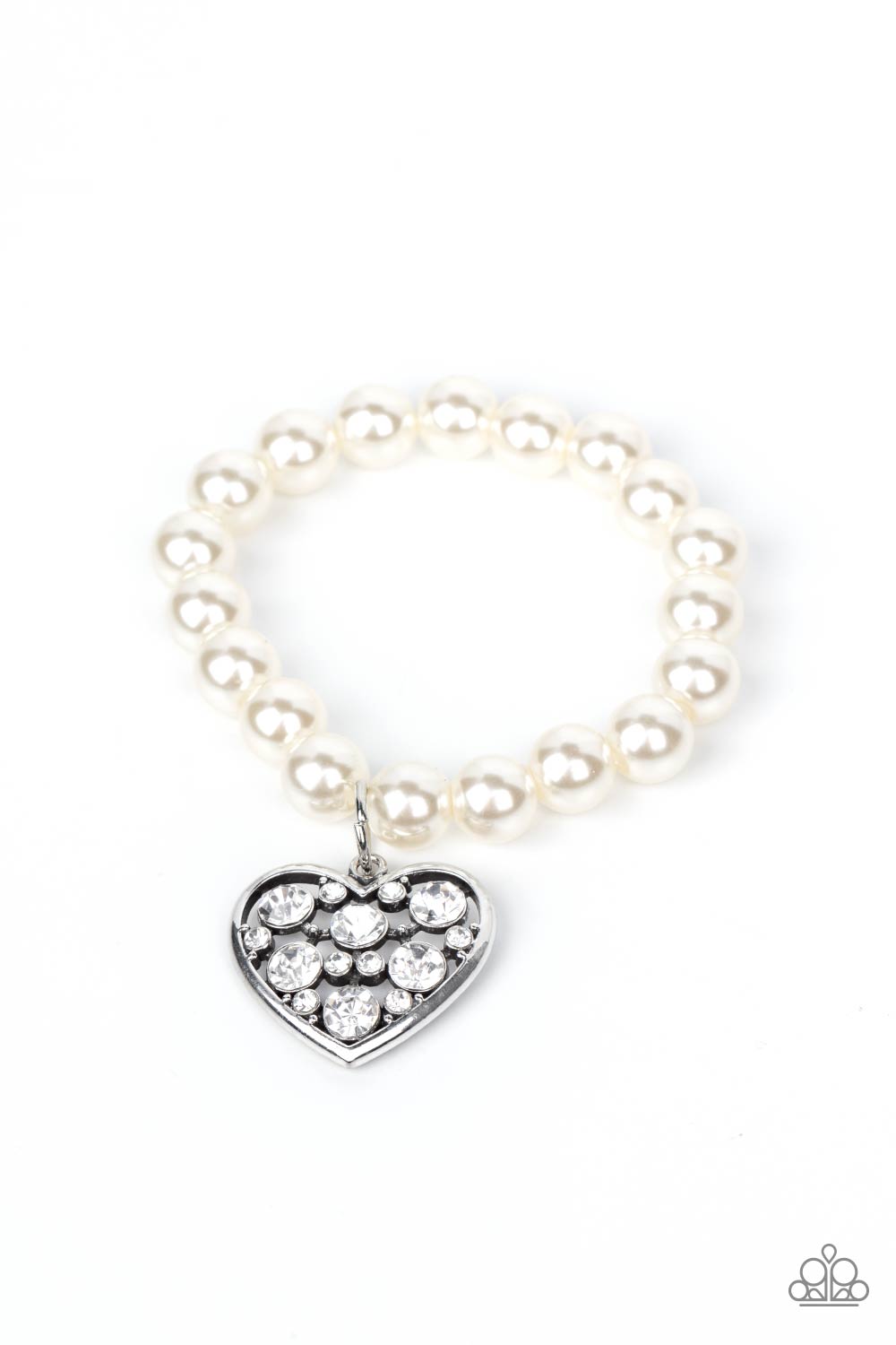 Cutely Crushing - White Pearl Heart Bracelets - Paparazzi dramatically oversized white rhinestone encrusted silver heart charm dangles from a stretchy strand of bubbly white pearls, creating a flirtatious dazzle. Sold as one individual bracelet. Paparazzi Jewelry is lead and nickel free so it's perfect for sensitive skin too!