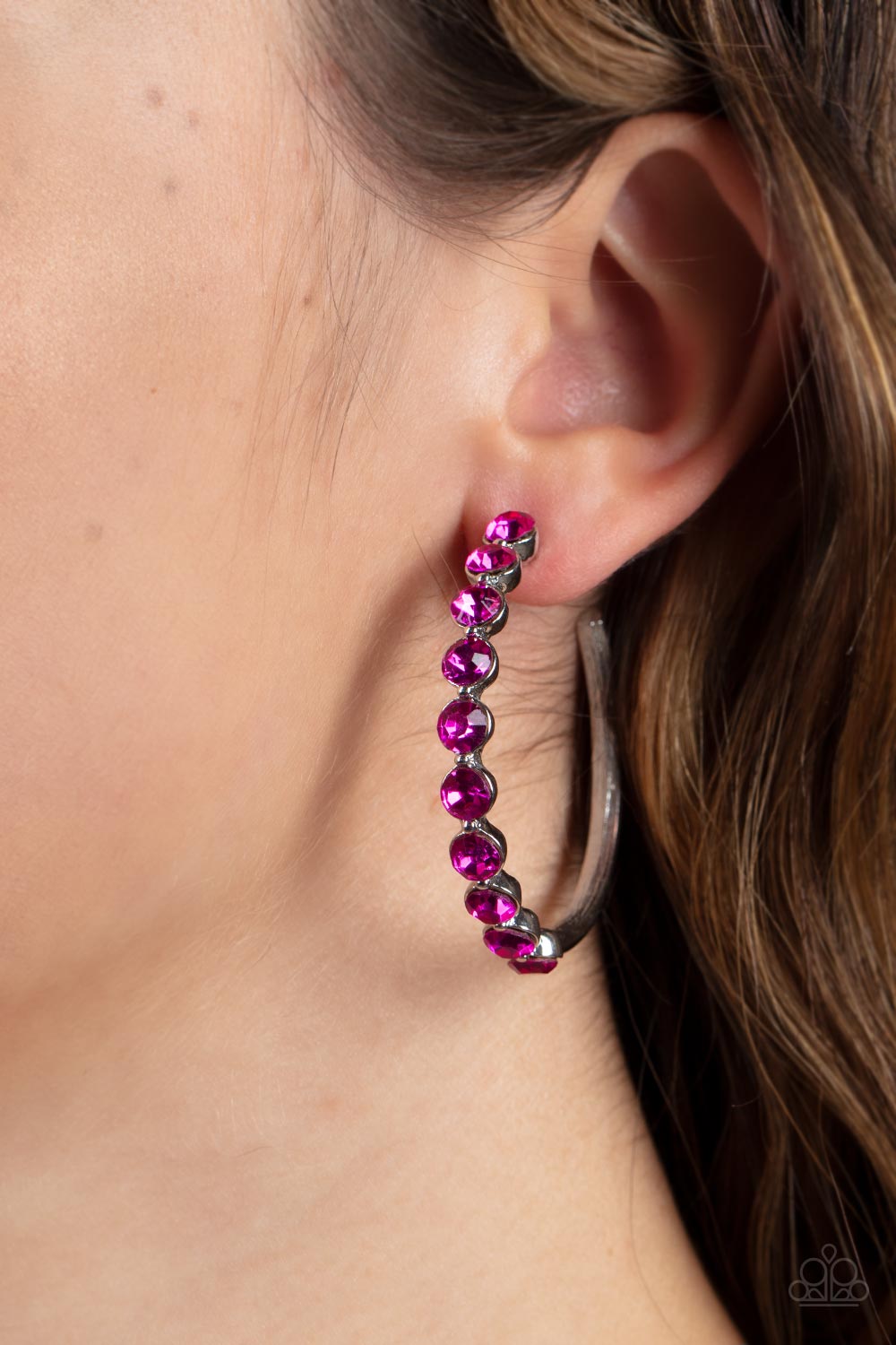 Photo Finish - Pink Rhinestone Hoop Earrings the front of a bold silver hoop is encrusted in flamboyant Fuchsia Fedora rhinestones, creating a glamorous pop of sparkle. Earring attaches to a standard post fitting. Hoop measures approximately 1 3/4" in diameter.  Sold as one pair of hoop earrings.