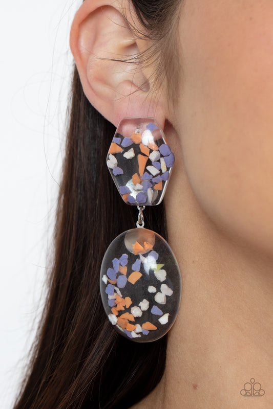 Paparazzi Accessories Flaky Fashion -Orange Earrings featuring multicolored confetti-like flakes, a clear acrylic oval frame swings from the bottom of a matching hexagonal frame, creating a bubbly lure. Earring attaches to a standard post fitting.  Sold as one pair of post earrings.  Paparazzi Jewelry is lead and nickel free so it's perfect for sensitive skin too!