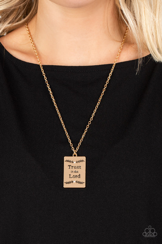 Paparazzi Accessories - All About Trust - Gold Necklaces bordered in leafy patterns and dainty white rhinestones, the center of a gold rectangular frame is stamped in the phrase, "Trust in the Lord," for an inspiring finish. Features an adjustable clasp closure.  Sold as one individual necklace. Includes one pair of matching earrings.