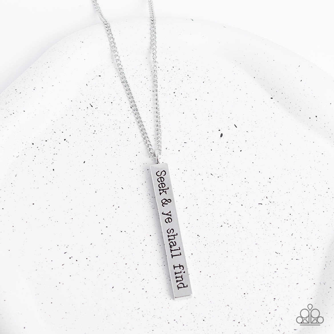 Paparazzi Accessories - Matt 7:7 - Silver Inspirational Necklaces a flattened rectangular pendant is stamped in the biblical phrase, "Seek & ye shall find. Matt7:7," creating an inspirational sight at the bottom of an extended silver chain. Features an adjustable clasp closure.  Sold as one individual necklace. Includes one pair of matching earrings.