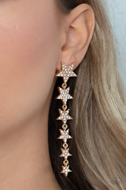 Paparazzi Accessories - Americana Attitud - Gold Star Earrings dotted with dainty white rhinestones, a stellar collection of gold stars graduate in size as they cascade from the ear for an out-of-this-world fashion. Earring attaches to a standard post fitting.  Sold as one pair of post earrings.