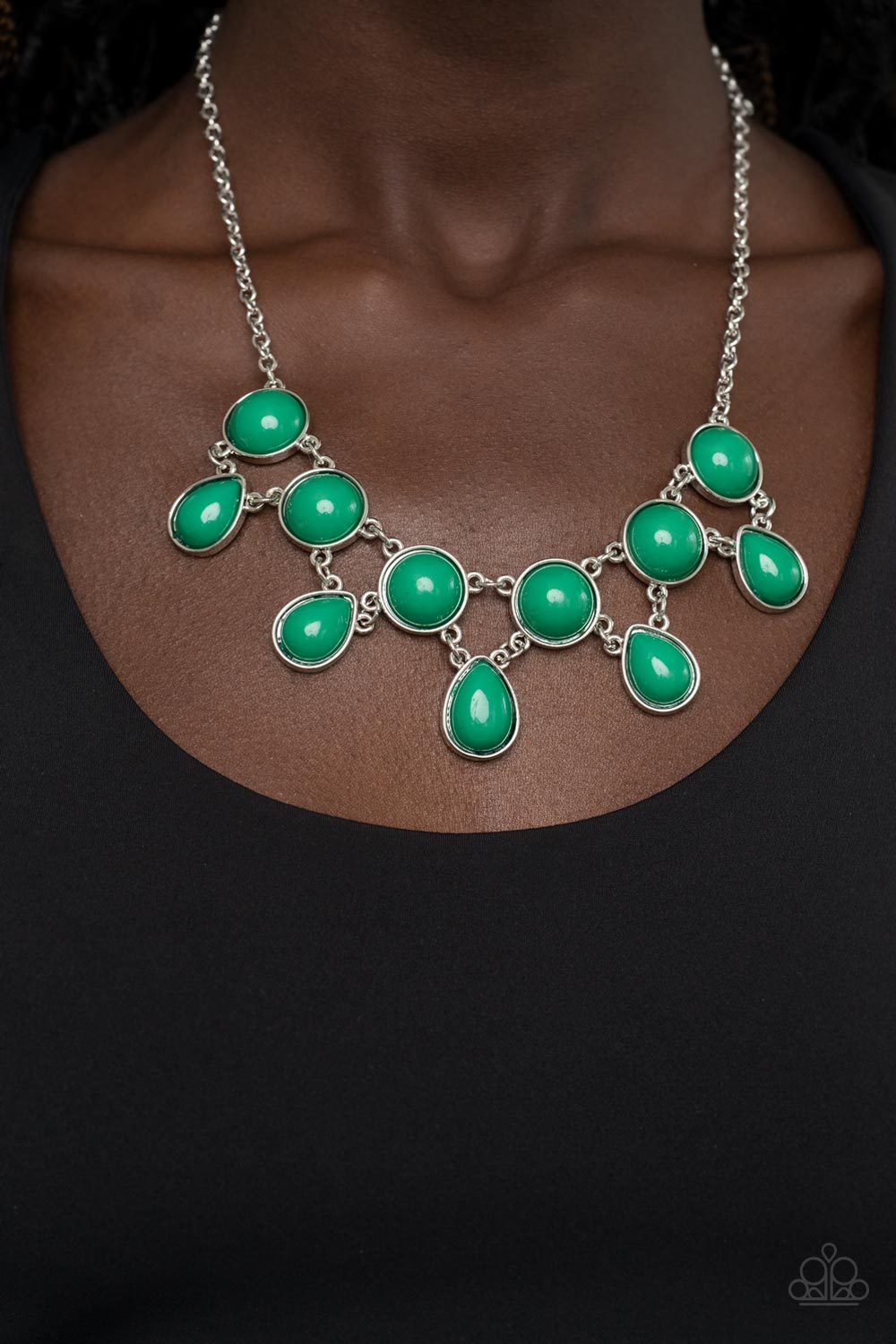 Paparazzi Accessories - Very Valley Girl - Green Necklaces a refreshing collection of Leprechaun teardrop beads links to the bottom row of oversized round Leprechaun beads, interlocking into a glamorous pop of color below the collar. Features an adjustable clasp closure. Sold as one individual necklace. Includes one pair of matching earrings.