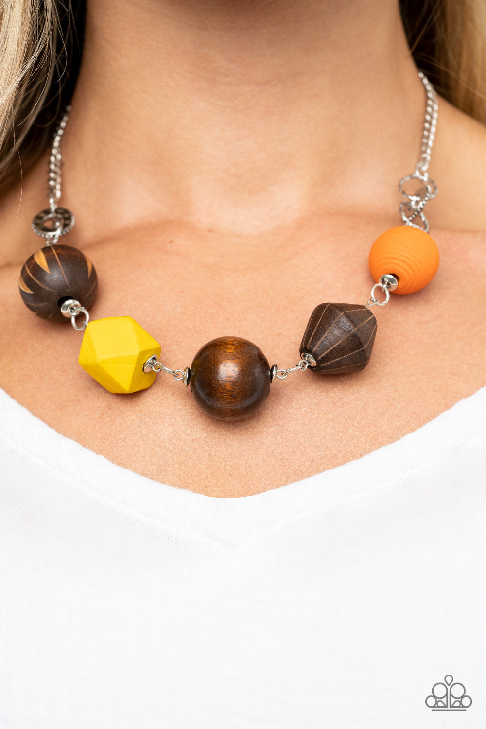 Paparazzi Eco Extravaganza - Multi Necklaces an infused with yellow and orange wooden beads, a mismatched assortment of studded silver hoops, textured silver rings, and oversized brown wooden beads delicately connect across the chest for a stylishly handcrafted fashion. Features an adjustable clasp closure. Sold as one individual necklace. Includes one pair of matching earrings.