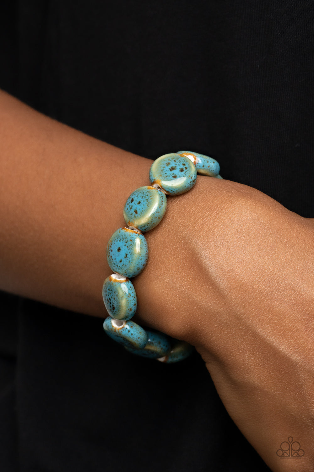 Paparazzi Accessories Earthy Entrada - Blue Stone Bracelets glazed in a distressed blue finish, an oversized collection of ceramic beads are threaded along a stretchy band around the wrist for a rustic fashion. Sold as one individual bracelet.
