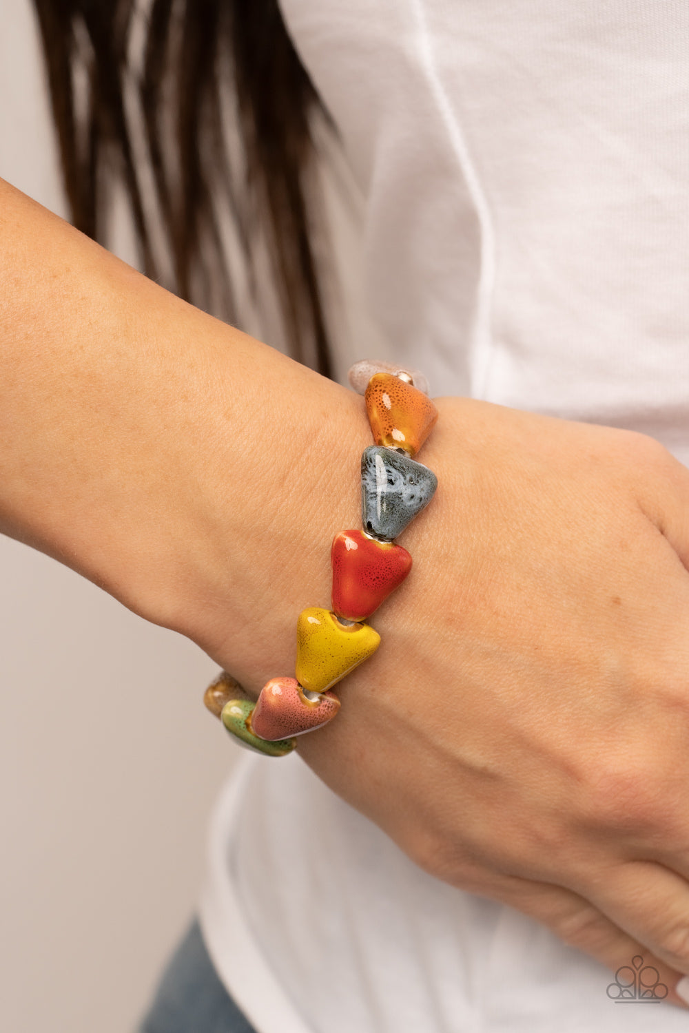 Paparazzi Accessories - SHARK Out of Water - Multi Bracelets painted in distressed multicolored finishes, ceramic beads shaped like shark teeth are threaded along a stretchy band around the wrist for a seasonal flair. Sold as one individual bracelet.