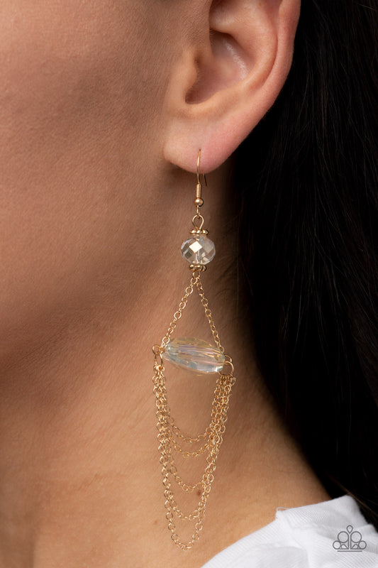 Ethereally Extravagant - Gold Chain Earrings tiers of dainty gold chains delicately layer from an oversized oval iridescent gem that is suspended from a faceted white crystal-like bead, resulting in an ethereal chandelier. Earring attaches to a standard fishhook fitting.  Sold as one pair of earrings.