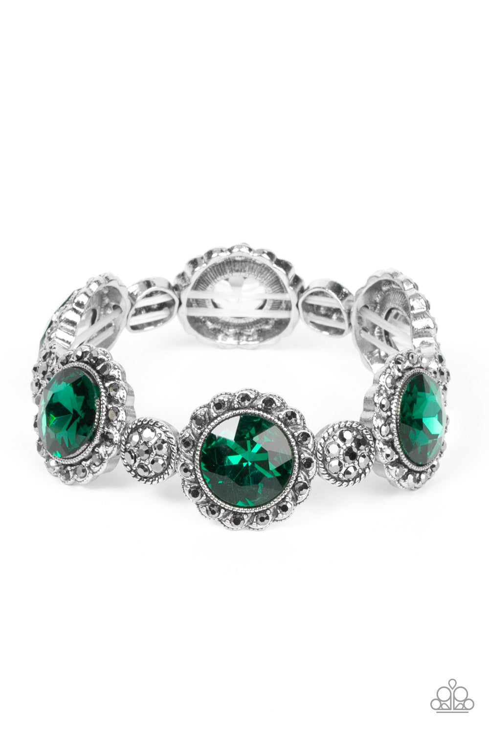 Paparazzi Accessories - Palace Property - Green Rhinestone Bracelets an oversized green rhinestone adorns the center of a hematite rhinestone petaled floral frame. Infused with hematite dotted silver accents, the glitzy floral frames sparkle along stretchy bands around the wrist for a glamorous finish. Sold as one individual bracelet.