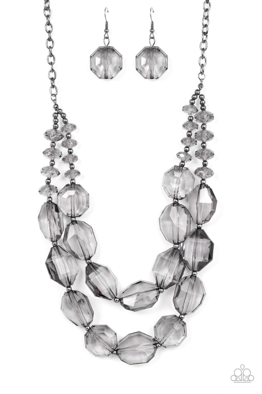 Paparazzi Icy Illumination - Black Faceted Necklaces separated by dainty silver beads, an icy collection of oversized and faceted smoky gems are threaded along invisible wires below the collar, resulting in prismatic layers. Features an adjustable clasp closure.  Sold as one individual necklace. Includes one pair of matching earrings.
