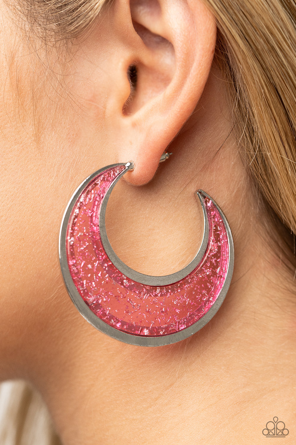 Charismatically Curvy - Pink Half Moon Earrings flecked in silver shavings, a glistening pink acrylic half moon frame is bordered with flat shiny bars that coalesce into a curvaceous hoop. Earring attaches to a standard post fitting. Hoop measures approximately 2" in diameter.  Sold as one pair of hoop earrings.