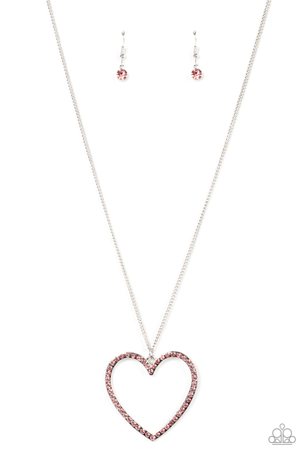 Va-Va Valentine - Pink Rhinestone Heart Necklaces an oversized silver heart frame is embellished with Pale Rosette rhinestones, resulting in a flirtatious pendant at the bottom of an extended silver chain. Features an adjustable clasp closure. Sold as one individual necklace. Includes one pair of matching earrings.