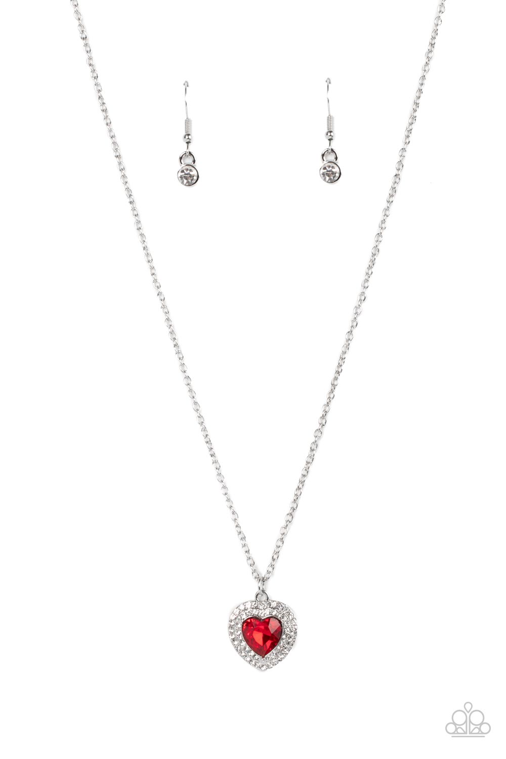 Taken With Twinkle - Red Heart Rhinestone Necklaces bordered in stacked rows of glassy white rhinestones, a fiery red heart shaped gem sparkles at the center of a dainty silver chain for a flirtatious fashion. Features an adjustable clasp closure.  Sold as one individual necklace. Includes one pair of matching earrings.
