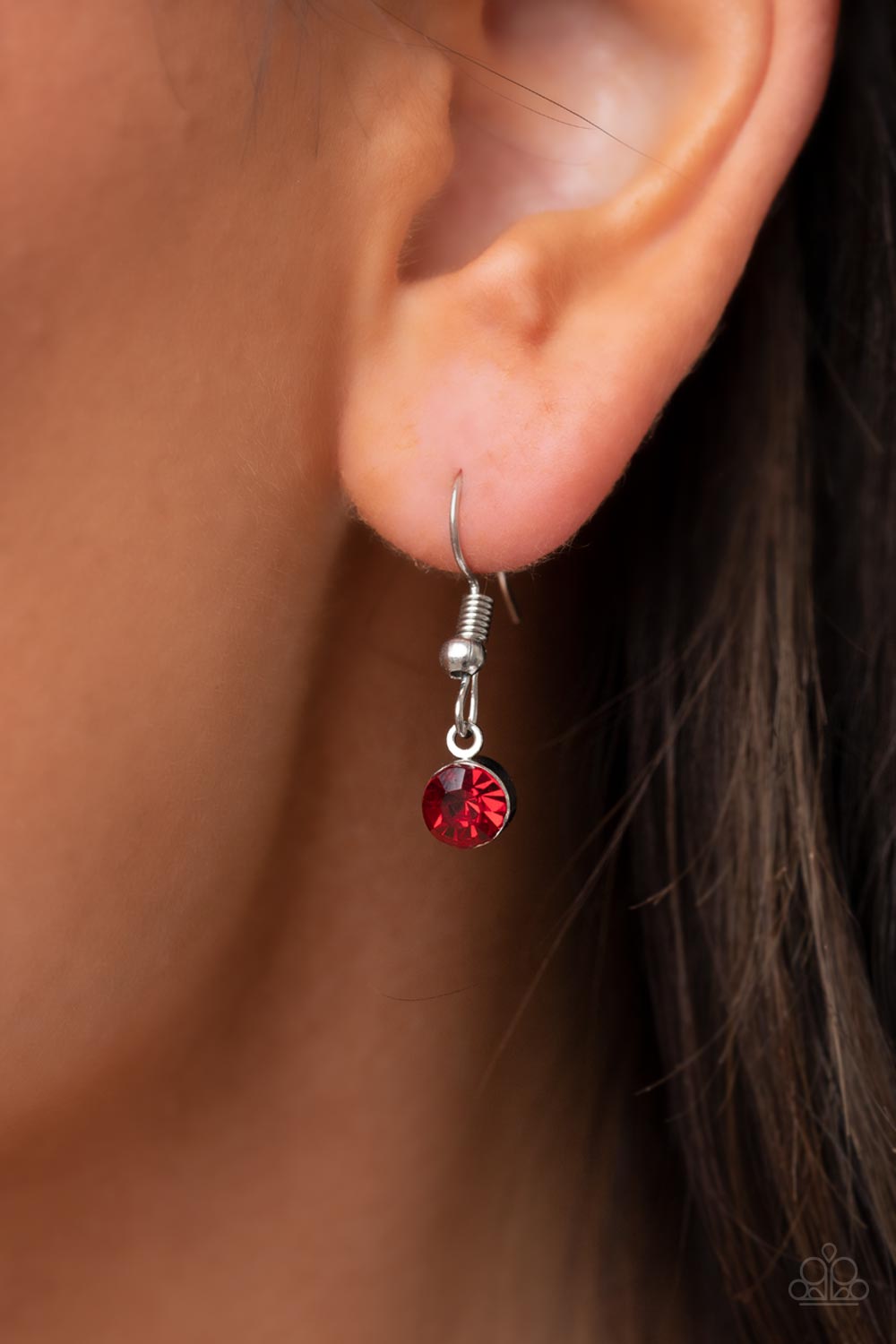 Taken With Twinkle - Red Heart Rhinestone Necklaces bordered in stacked rows of glassy white rhinestones, a fiery red heart shaped gem sparkles at the center of a dainty silver chain for a flirtatious fashion. Features an adjustable clasp closure.  Sold as one individual necklace. Includes one pair of matching earrings.