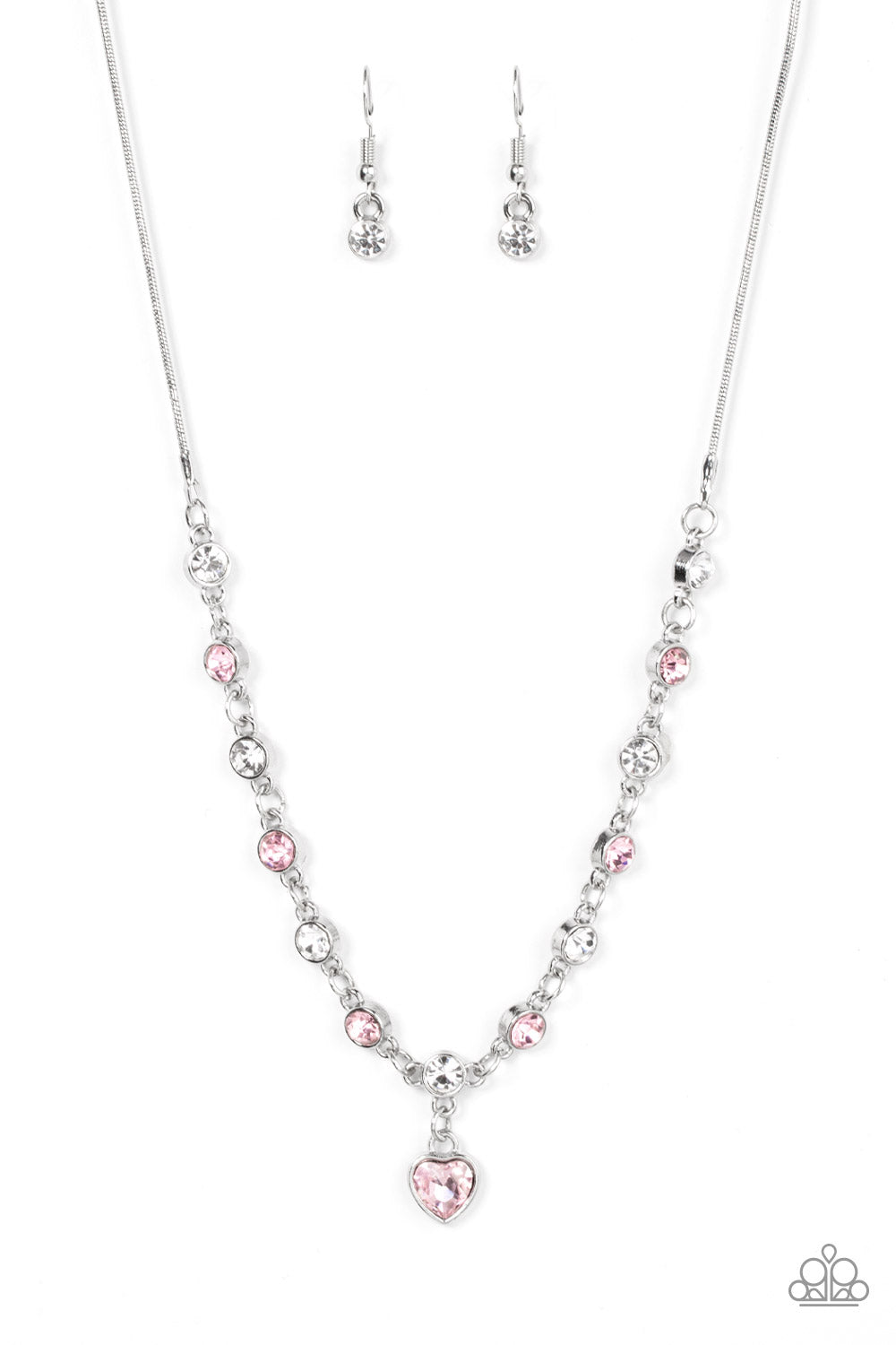 True Love Trinket - Pink Heart Necklaces a pink rhinestone heart charm dances from a strand of white and pink rhinestones, resulting in a flirtatious sparkle below the collar. Features an adjustable clasp closure. Sold as one individual necklace. Includes one pair of matching earrings.