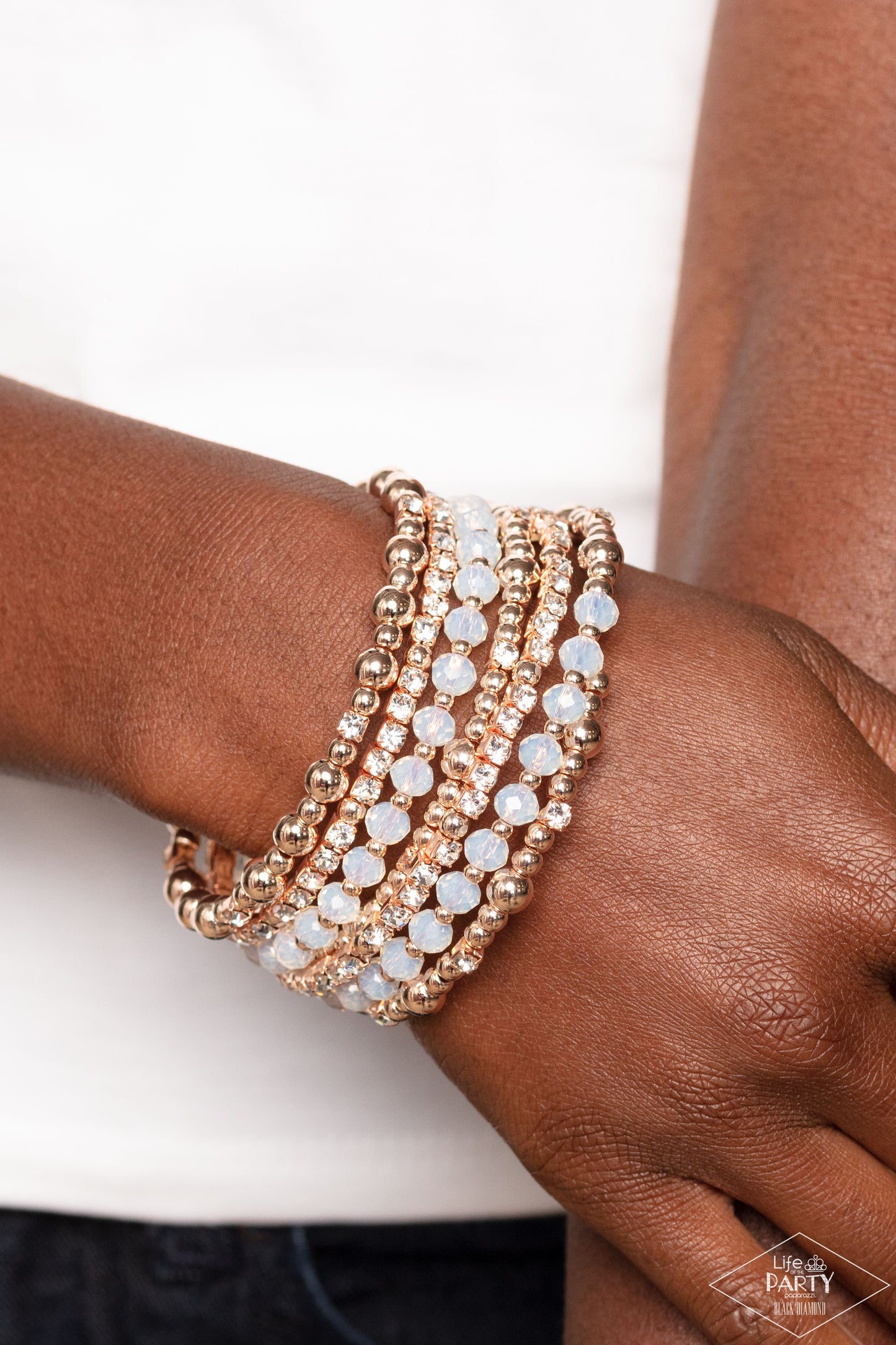 Paparazzi Accessories - Ice Knowing You - Rose Gold Bracelets an icy collection of rose gold beads, rose gold cubes, opaque crystals, and glassy white rhinestones are threaded along a coiled wire, creating a blinding infinity wrap style bracelet around the wrist.  Sold as one individual bracelet.