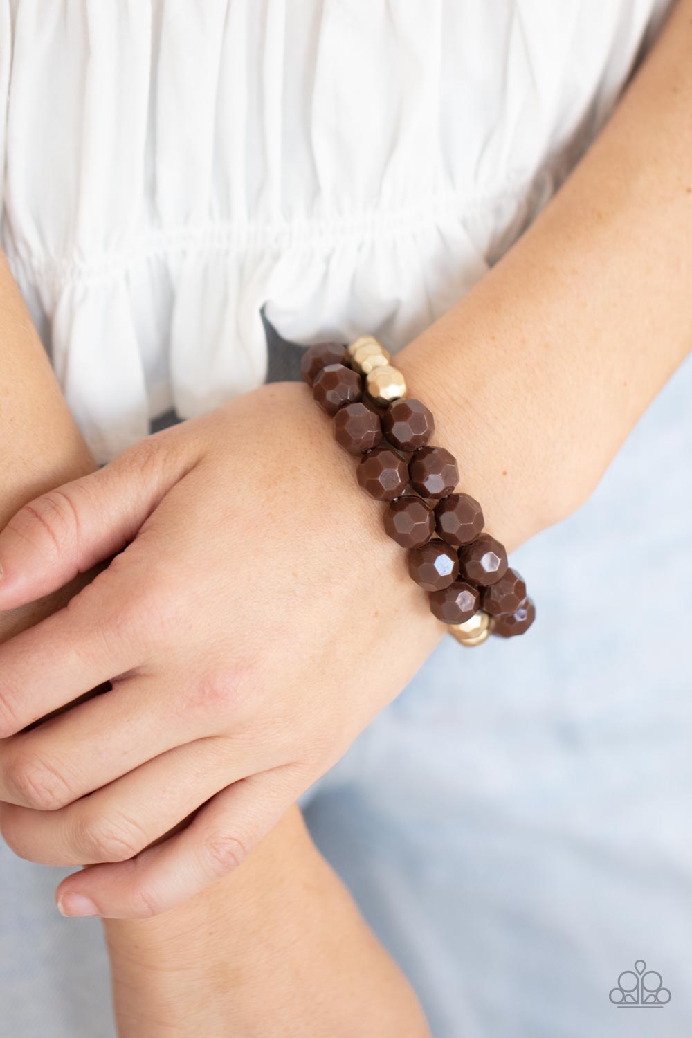 Paparazzi Accessories - Grecian Glamour - Brown Stretchy Bracelets faceted Coca Mocha and golden acrylic beads are threaded along stretchy bands, creating a modern pop of color around the wrist. Sold as one pair of bracelets. Get The Complete Look! Necklace: "Greco Getaway - Brown" (Sold Separately)