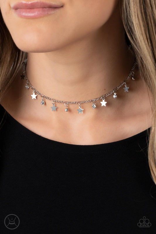 Paparazzi Little Lady Liberty - Silver Star Necklaces dainty white rhinestones and flat silver stars twinkle along a classic silver chain around the neck, resulting in a stellar fringe. Features an adjustable clasp closure.  Sold as one individual choker necklace. Includes one pair of matching earrings.