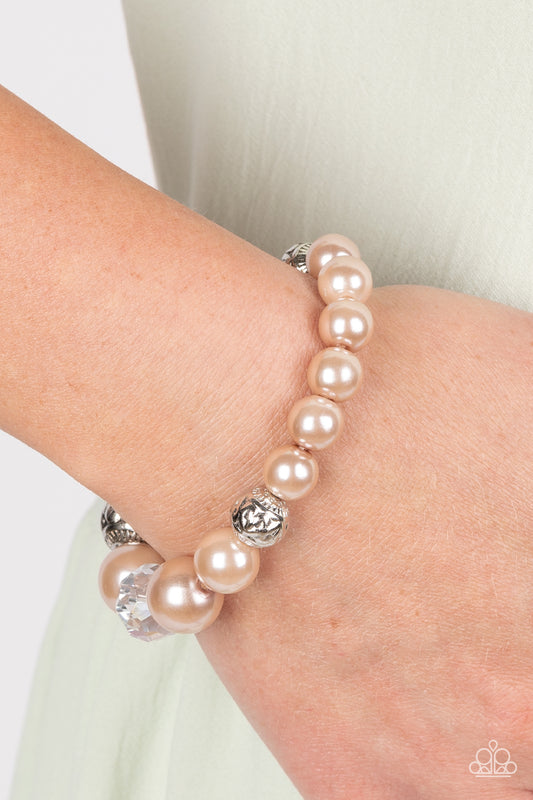 Paparazzi Accessories - Royal Reward - Brown Pearl Bracelets bubbly Iced Coffee pearls, silver antique-detailed balls, and reflective beads nobly drape around the wrist on an elastic stretchy band for a refined pop of color.  Sold as one individual bracelet.  Get The Complete Look! Necklace: "The NOBLE Prize - Brown" (Sold Separately)