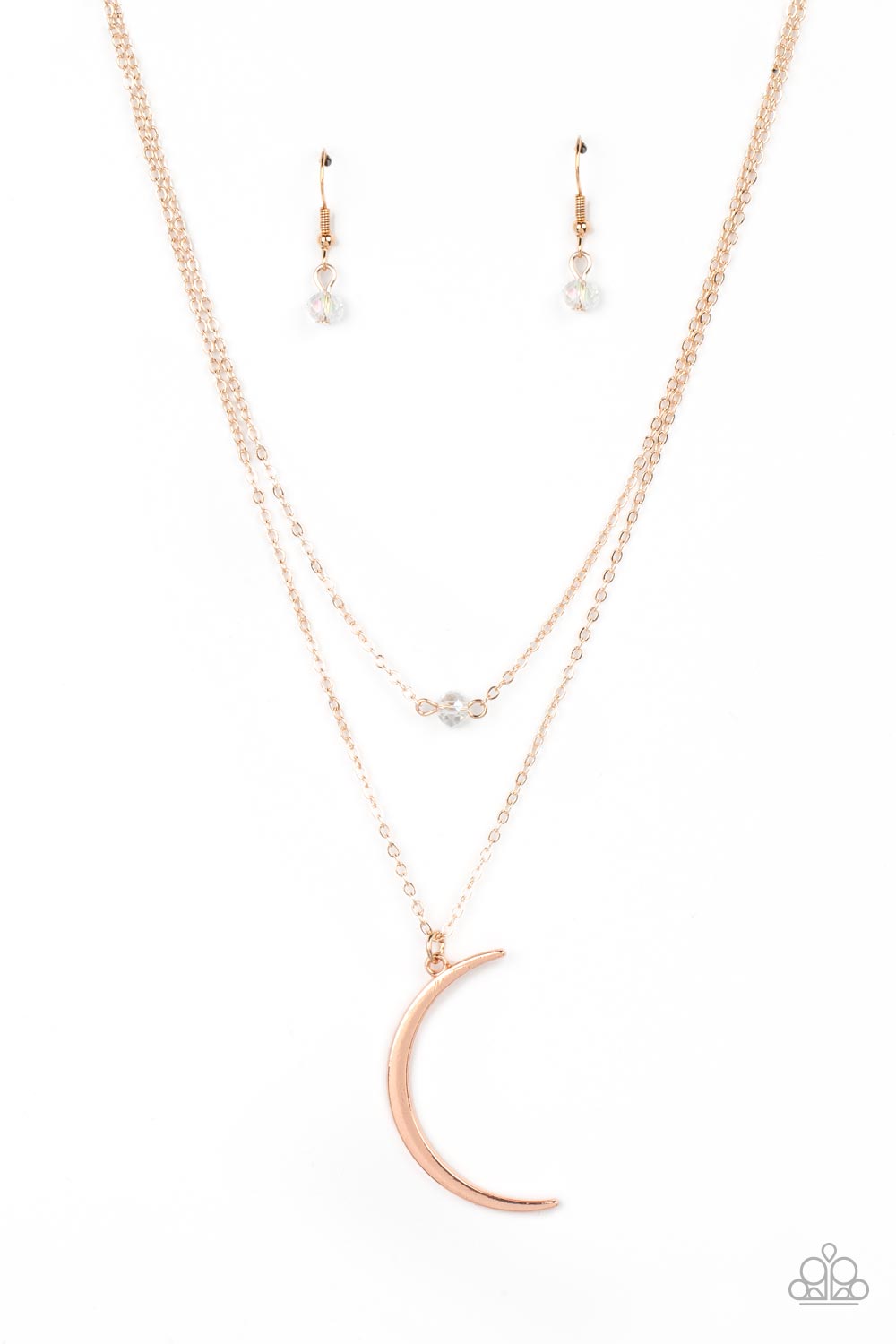 Rose Gold Necklaces two dainty rose gold chains delicately layer below the collar. A white crystal-like bead sparkles at the center of the uppermost chain while a rose gold half moon pendant swings from the bottom of the display for a mystical finish. Features an adjustable clasp closure.  Sold as one individual necklace. Includes one pair of matching earrings.