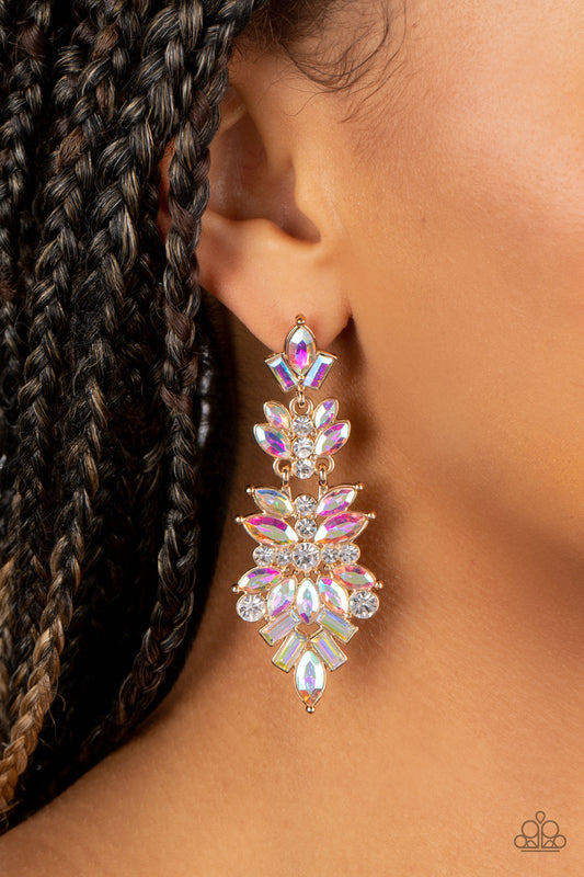 Paparazzi Accessories Frozen Fairytale - Multi Iridescent Rhinestone Earrings featuring white and iridescent finishes, trestles of round, marquise, and emerald cut rhinestones cluster into three sparkly segments as they link into a jaw-dropping lure. Earring attaches to a standard post fitting. Due to its prismatic palette, color may vary.  Sold as one pair of post earrings.