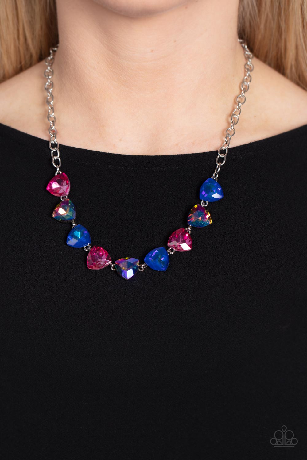 Paparazzi Accessories - Dreamy Drama - Blue EMP 2023 Necklaces a collection of dreamy trilliant-cut rhinestones in iridescent shades of blue and pink fall in line along the collar in a majestic finish. Features an adjustable clasp closure. Due to its prismatic palette, color may vary.  Sold as one individual necklace. Includes one pair of matching earrings.