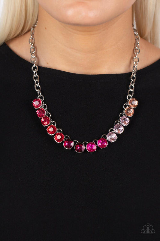Paparazzi Accessories Rainbow RESPLENDENCE - Pink Rhinestone Necklaces set in bold silver fittings, a rainbow of oversized rhinestones in varying shades of pink sparkles below the collar for an out-of-this-world statement. Features an adjustable clasp closure.  Sold as one individual necklace. Includes one pair of matching earrings.