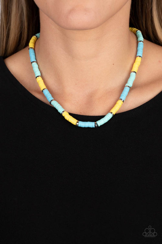 Rubber discs in shades of Waterspout, Primrose, and turquoise are threaded along an invisible wire, adorning the collar in a courageous pop of color. Shiny silver discs separate the bands of color, adding a hint of industrial sheen to the youthful design. Features an adjustable clasp closure.  Sold as one individual necklace. Includes one pair of matching earrings.
